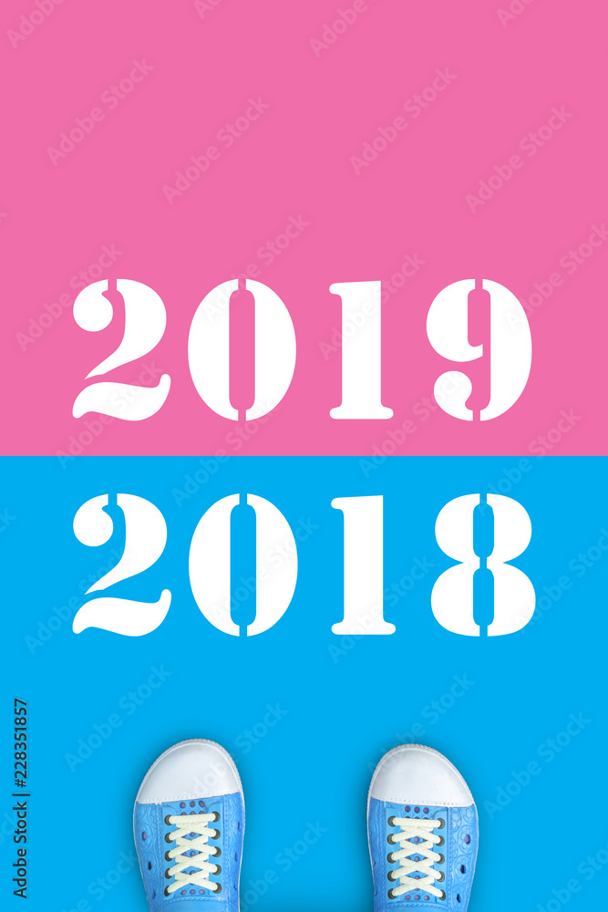 Blue shoes standing on the road from year 2018 to 2019 Blue shoes standing on the road from year 2018 to 2019