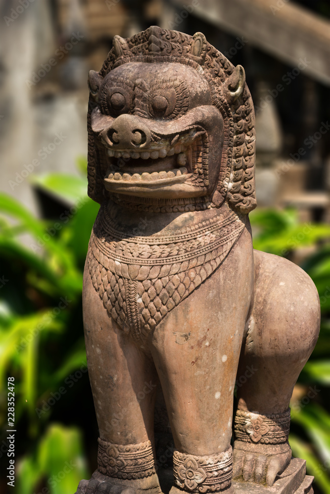 Ancient khmer stone statue of sacred beast lion (Singha). Khmer lion