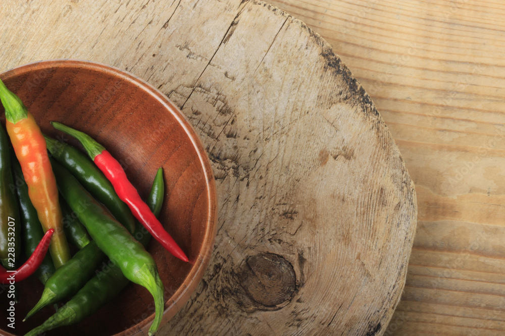 heap of chili pepper on wooden background