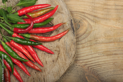 heap of red chili pepper on wooden background