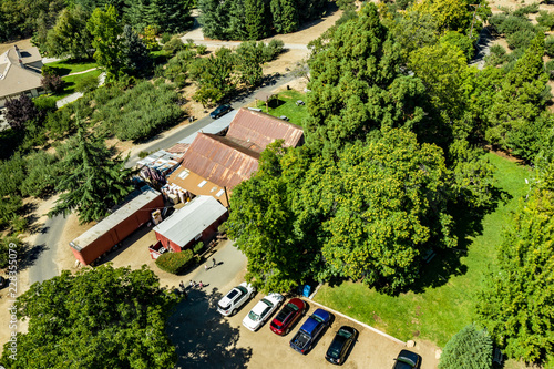 Aerial, drone view of Oak Glen located between the San Bernardino Mountains and Little San Bernardino Mountains with several apple orchards before the Fall color change photo