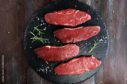 Barbecue rump Steak, dry Aged Steak on rustic background photo