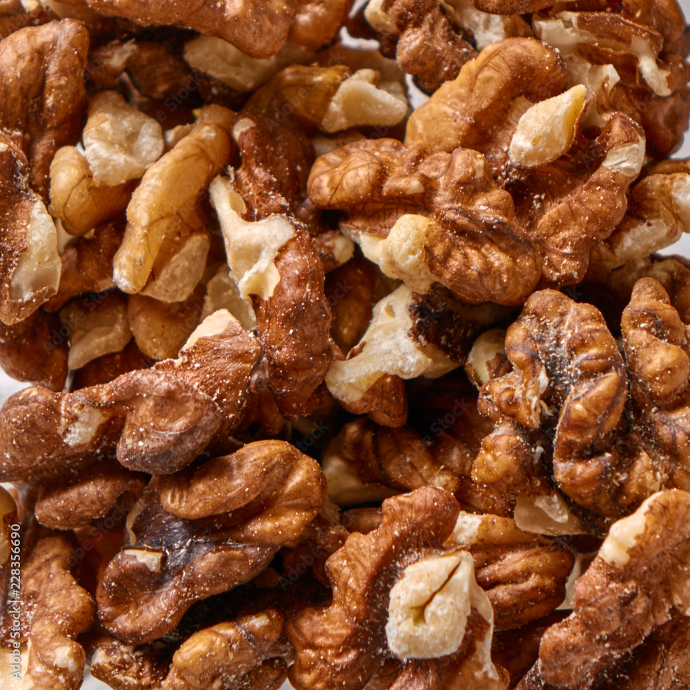 Close-up of peeled raw walnuts as a natural background. Vegetable protein for vegans. Flat lay