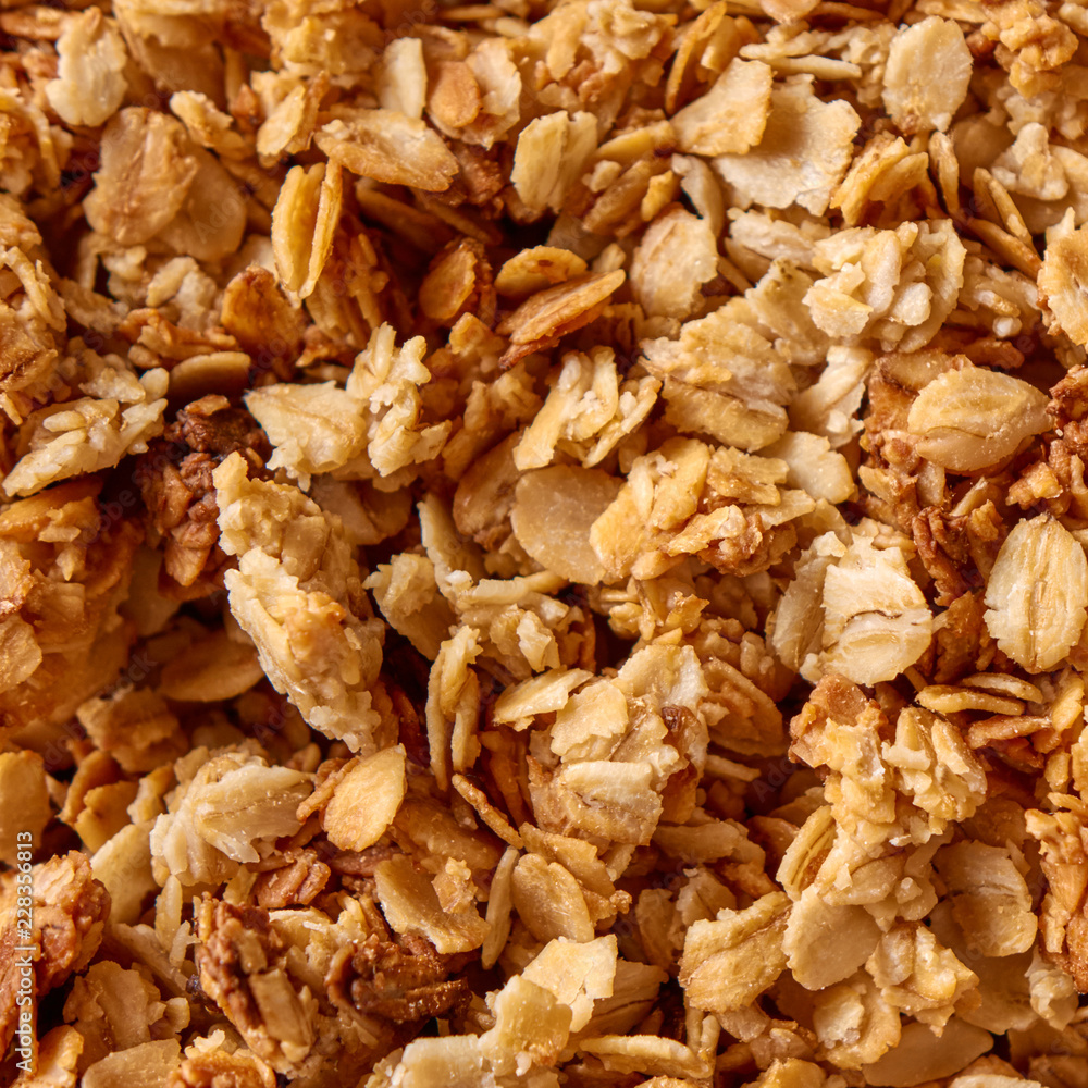 Close-up of homemade natural Oat Granola breakfast cereal as background. Textura of oat flakes. Close-up of homemade natural Oat Granola breakfast cereal as background. Textura of oat flakes.