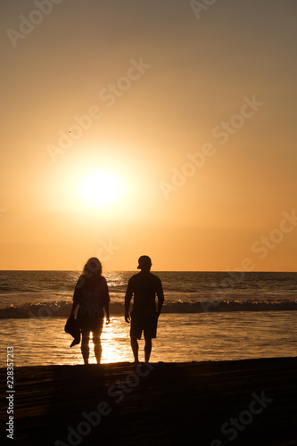 couple on the beach of the pacific ocean in Guatemala during sunset