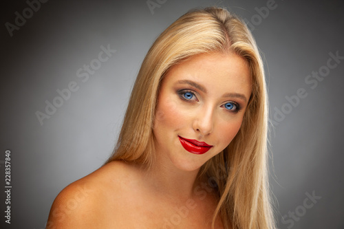 Beauty portrait of Gorgeous young woman with blond hair and blue eyes