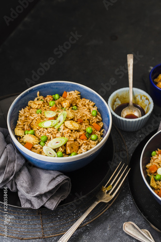 Honey soy stir fried rice with tofu served in bowl photo