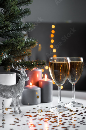 Christmas glasses of champagne with lights on the background