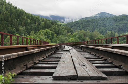 Railway travel and beautiful mountainous landscape horizon