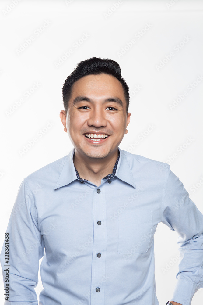 Asian man in work attire looking very happy Asian man in work attire looking very happy