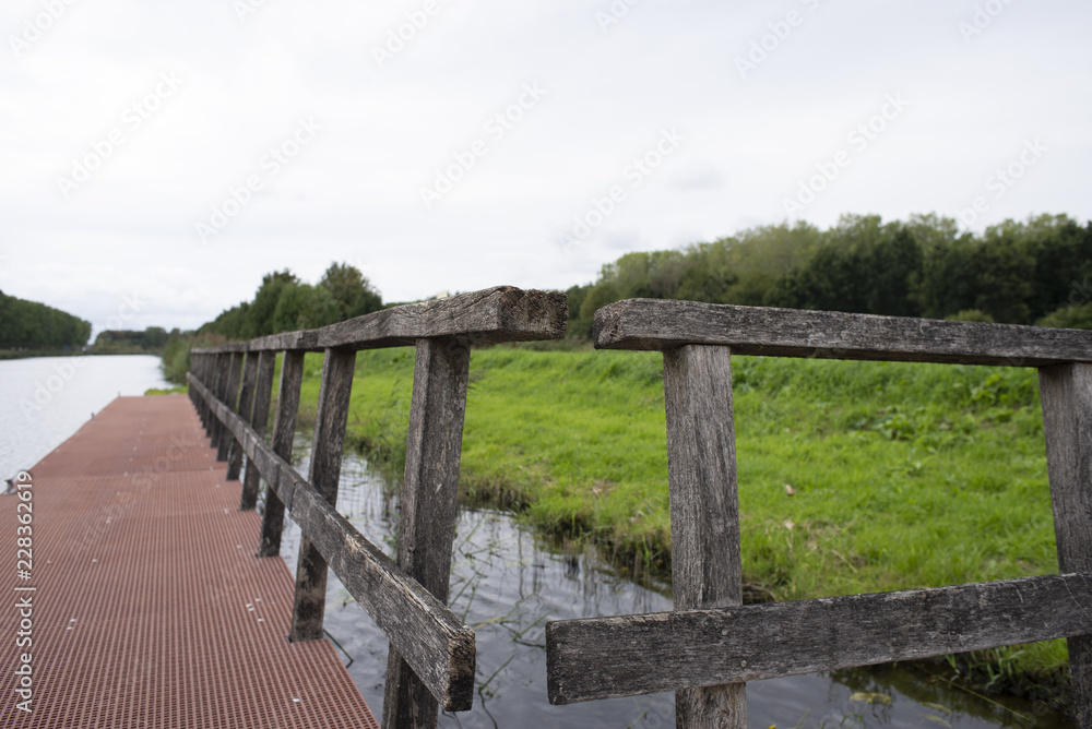 Small wooden dock near Green Cathedral not far from the Almere, Netherlands