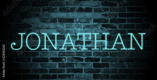 first name Jonathan in blue neon on brick wall
