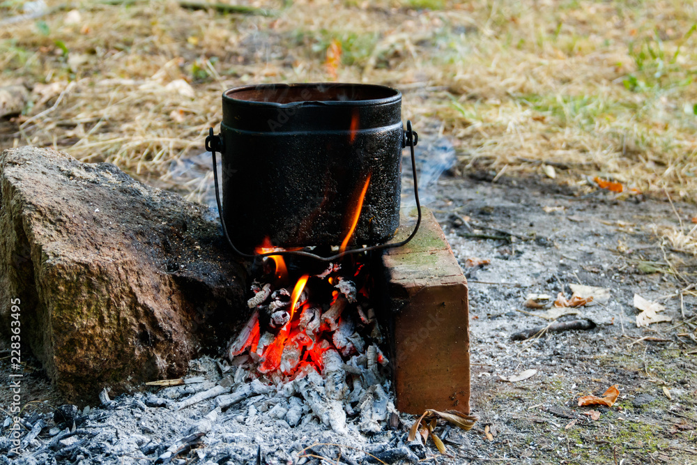 Cooking on campfire in camping Cooking on campfire in camping