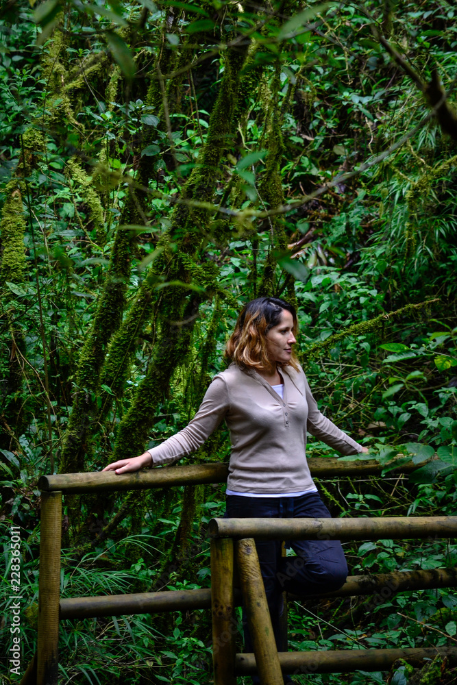 woman in nature on a natural bridge woman in nature on a natural bridge