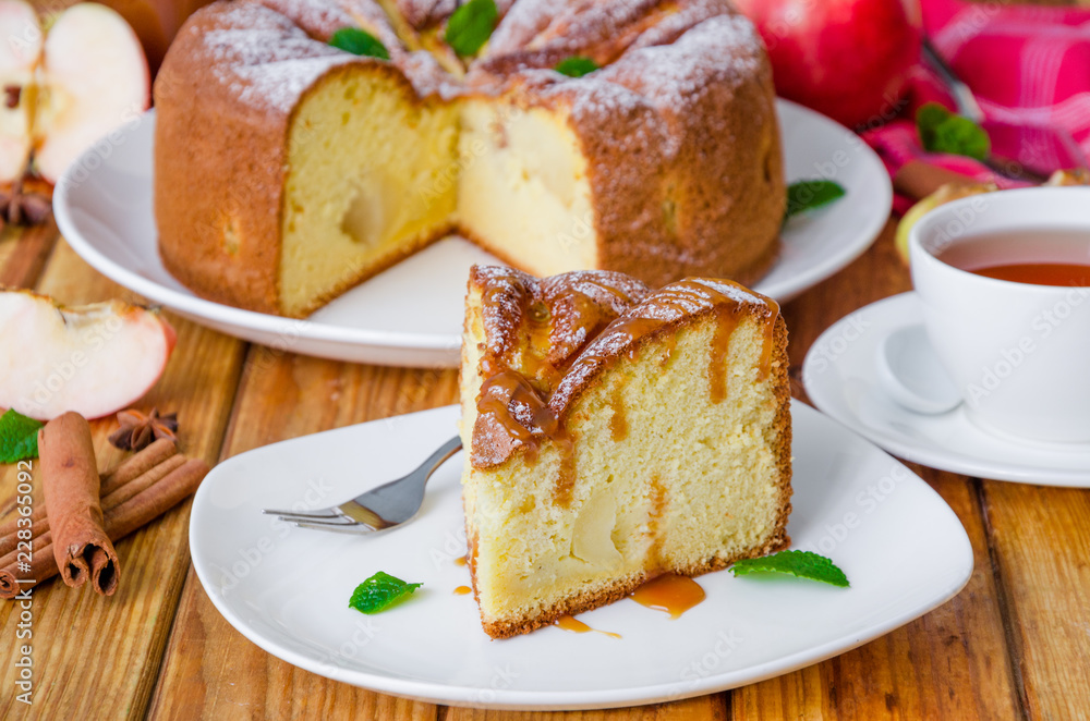 Delicious apple pie with cinnamon and caramel sauce. Traditional cake Charlotte. Delicious apple pie with cinnamon and caramel sauce. Traditional cake Charlotte.