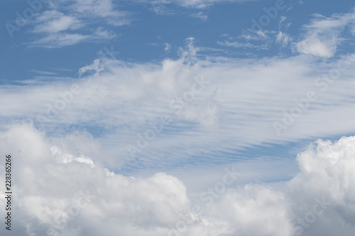 Cirrostratus and cumulus clouds.
