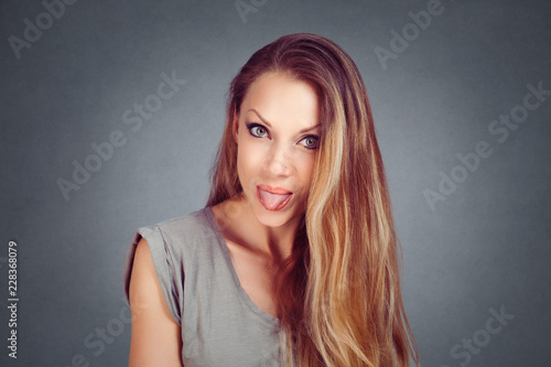 woman shows tongue bullying someone