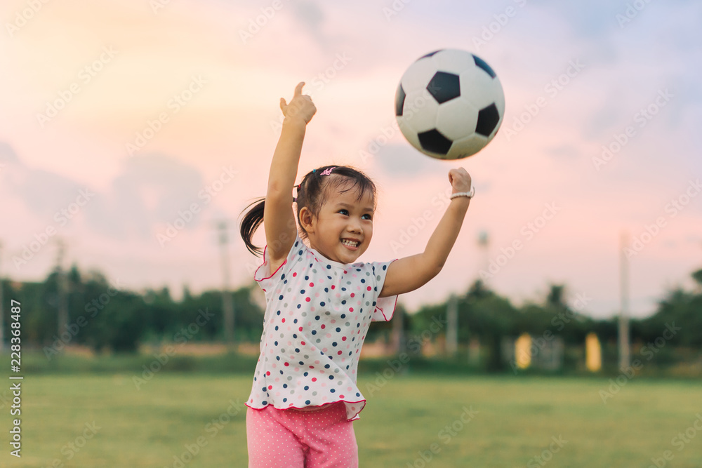 kids are playing soccer football for exercise under the sunlight. Film picture style.. kids are playing soccer football for exercise under the sunlight. Film picture style..