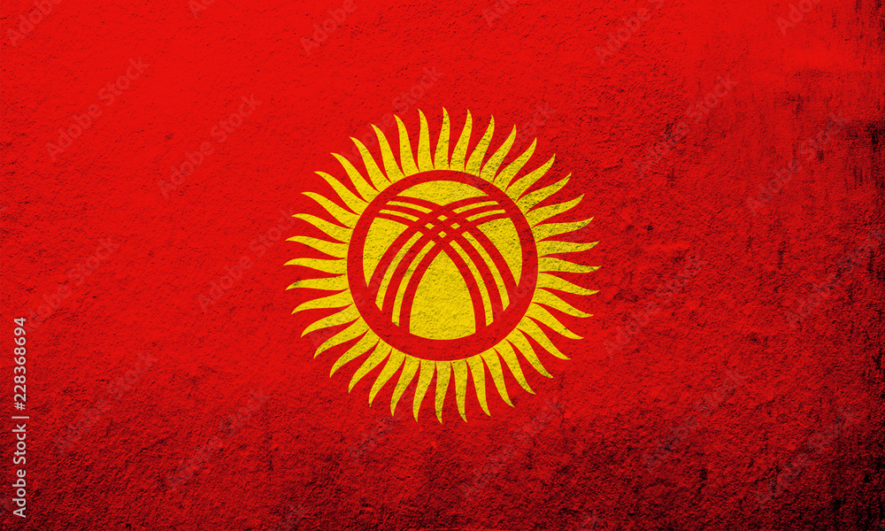 The Kyrgyz Republic (Kyrgyzstan) National flag. Grunge background The Kyrgyz Republic (Kyrgyzstan) National flag. Grunge background