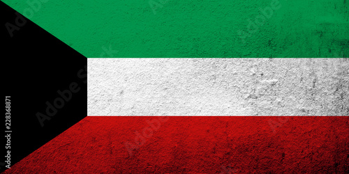 The State of Kuwait National flag. Grunge background photo