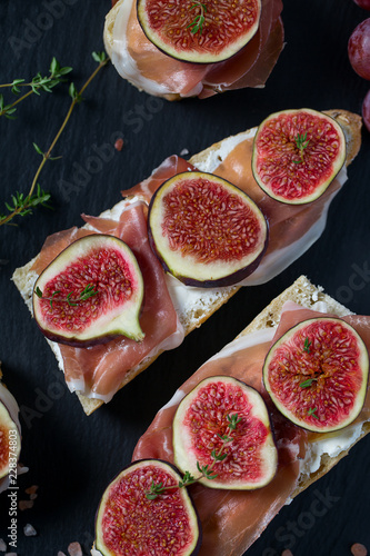 whole bread with cheese, parma ham and figs