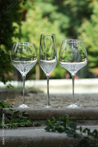 glass goblets standing on the steps outside in sunny weather vintage