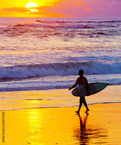 Surfer at sunset. Bali island