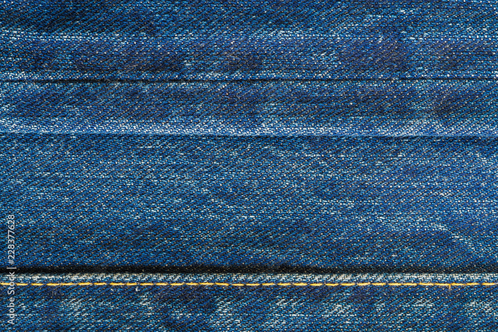 Naklejka premium Close up of blue jeans, beautiful retro denim with seam, Top view.