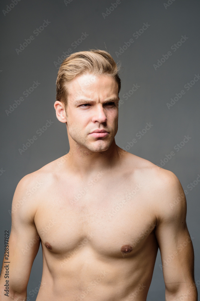 Attractive and seductive sensual look. Muscular sexy man. Handsome man with athletic body shirtless. Male beauty, cosmetics. Confident muscular guy. Strong healthy athletic fitness model. Bodybuilder.