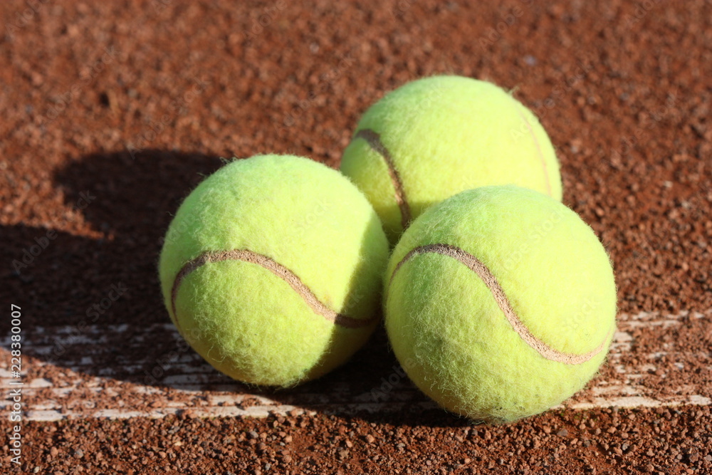 Tennis balls on the court.