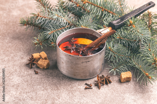 Hot mulled wine in a small vintage pan photo