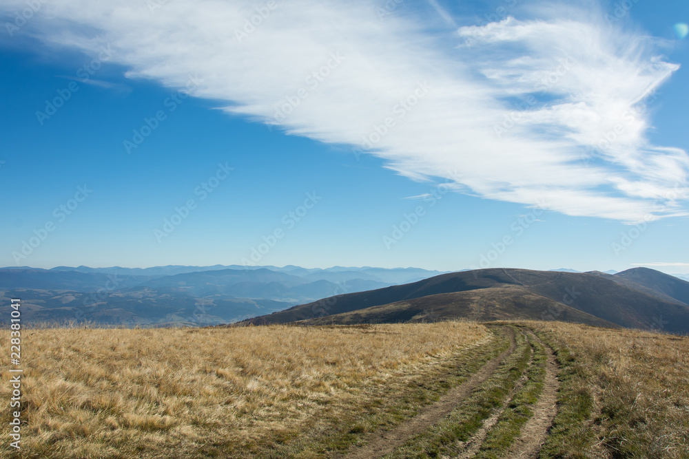 a gauge of road leading along a ridge towards the horizon a gauge of road leading along a ridge towards the horizon