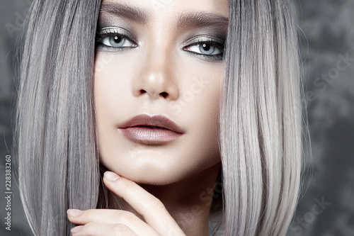 Young beautiful girl with silver make-up and ash hair photo