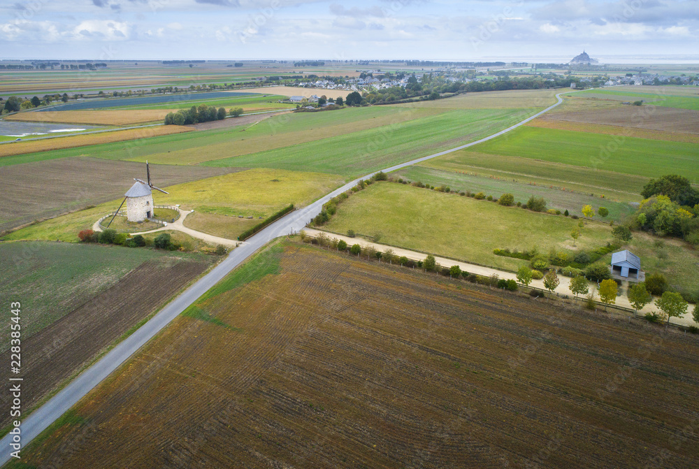 aerial view to road and old wind mill in France