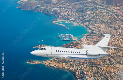 Luxury design private jet flying over the city