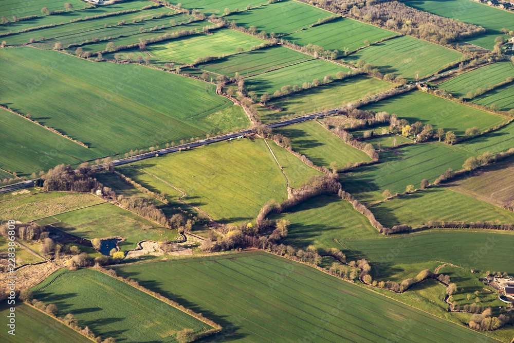 aerial view of green fields and slopes