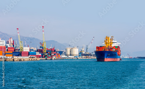 International Container Cargo ship in the port of genoa - Industrial port of genoa , italy

