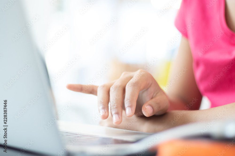 The hand of a woman typing the laptop. The hand of a woman typing the laptop.