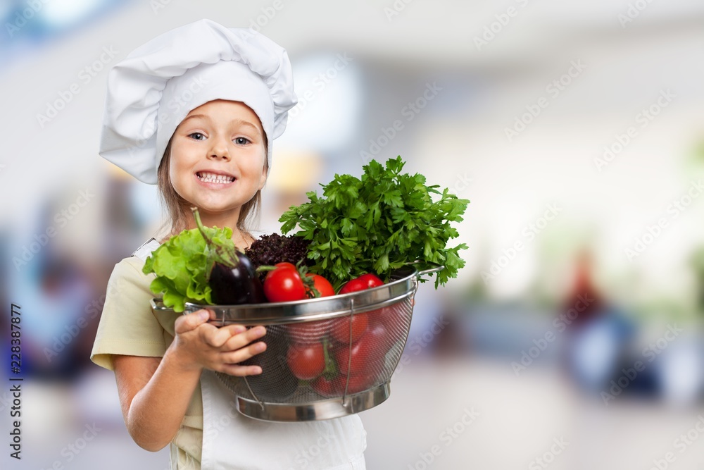 Portrait of adorable little girl preparing healthy