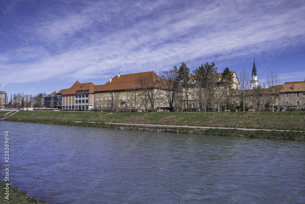Old and modern palaces along river Savinja in old town Celje, Slovenia Old and modern palaces along river Savinja in old town Celje, Slovenia