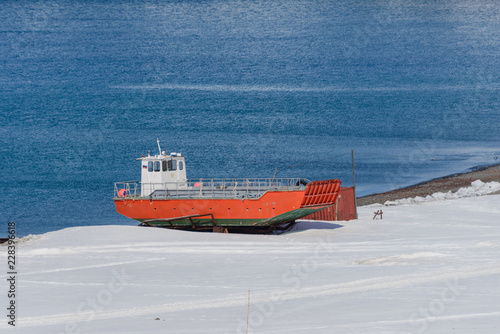 Orange boat on shore near Bellingshausen Russian Antarctic research station