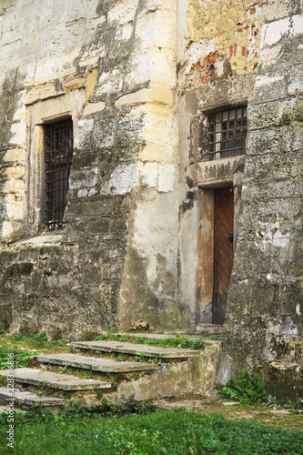 Fototapeta Naklejka Na Ścianę i Meble -  Old ruined tower entrance. Historical Lviv.