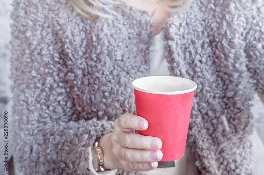 girl holding a red paper Cup of coffee girl holding a red paper Cup of coffee