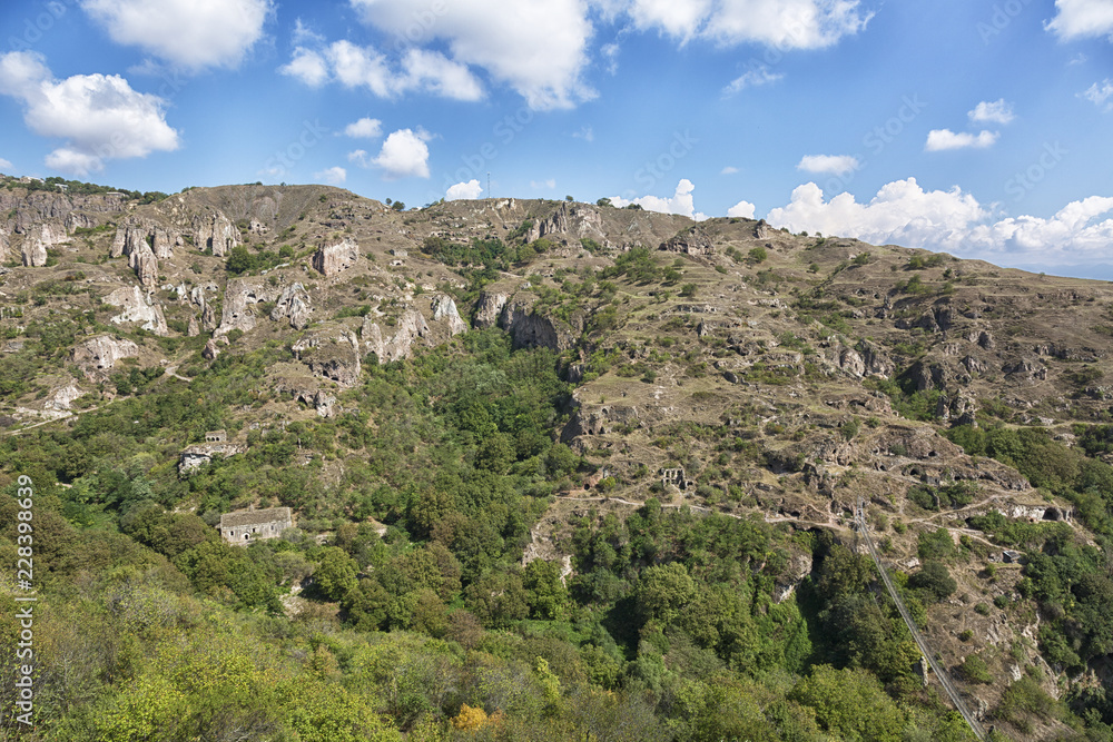 beautiful canyon at Khndzoresk cave settlement (13th-century, used to be inhabited till the 1950s) with a suspension bridge underneath, Syunik region, Armenia