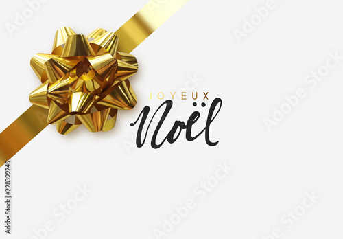 French lettering Joyeux Noel. Merry Christmas Holiday background. Greeting card with lush gold bow