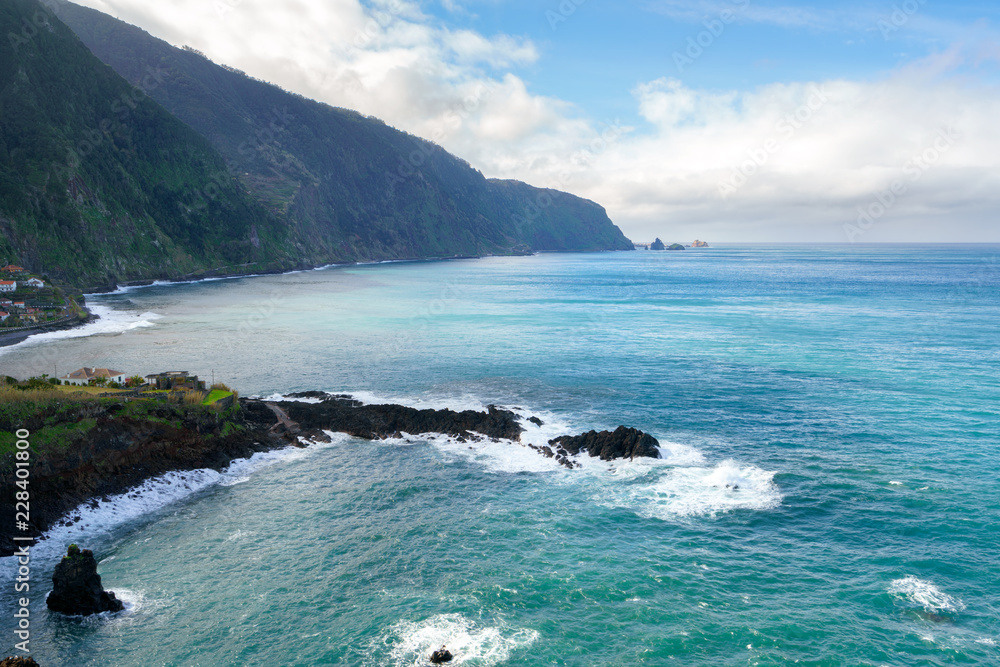 Beautiful black rock beach in Seixal, Madeira with waves crashing Beautiful black rock beach in Seixal, Madeira with waves crashing
