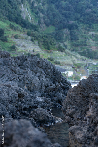 Beautiful black rock beach in Seixal, Madeira with waves crashing