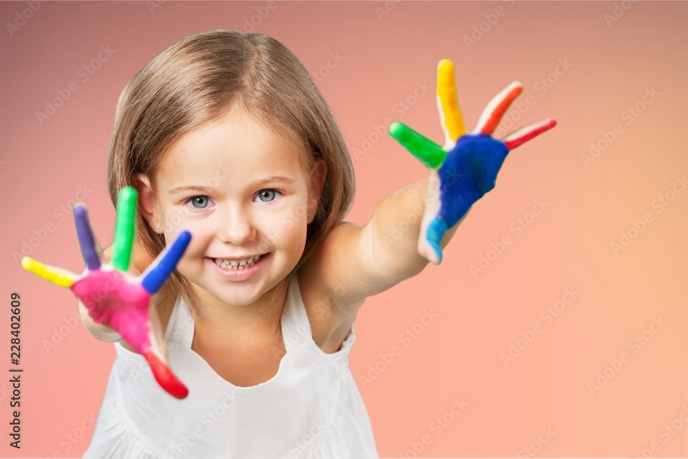 Little girl with colorful painted hands Little girl with colorful painted hands