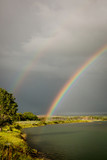Double rainbow over river