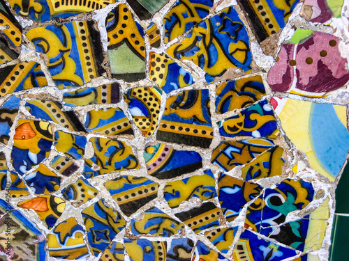 Close-up of the colorful mosaic tiles from the bench in Gaudi's Park Güell in Barcelona